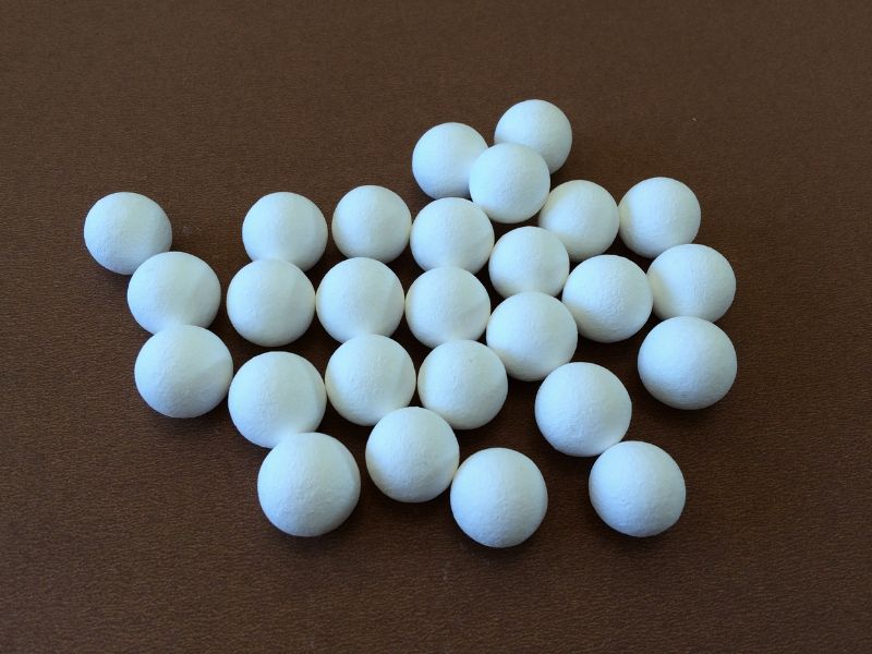 Inert ceramic ball catalyst support media in a range of sizes