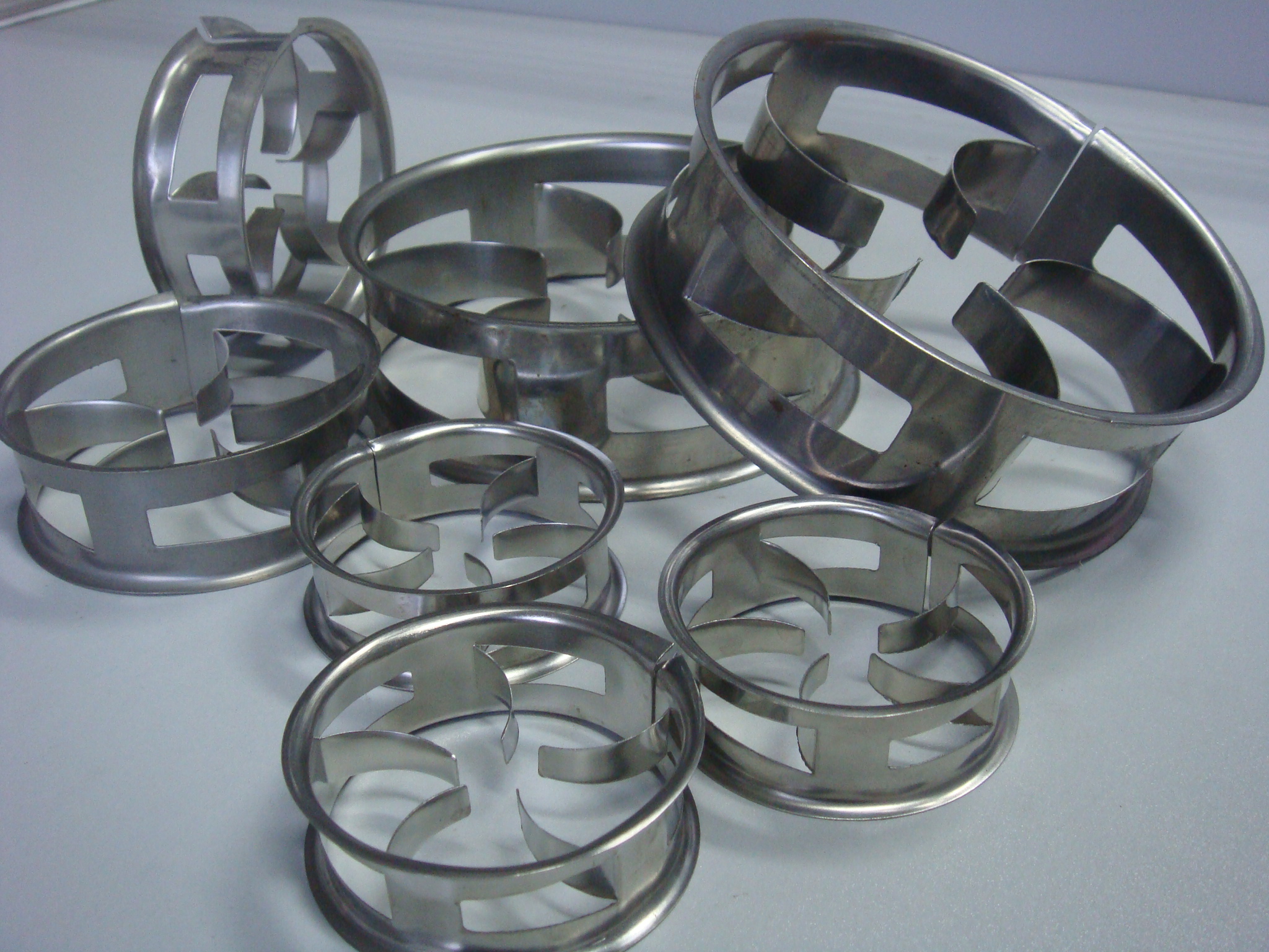 Random packing media including Pall rings, Raschig rings and saddle types for mass transfer columns
